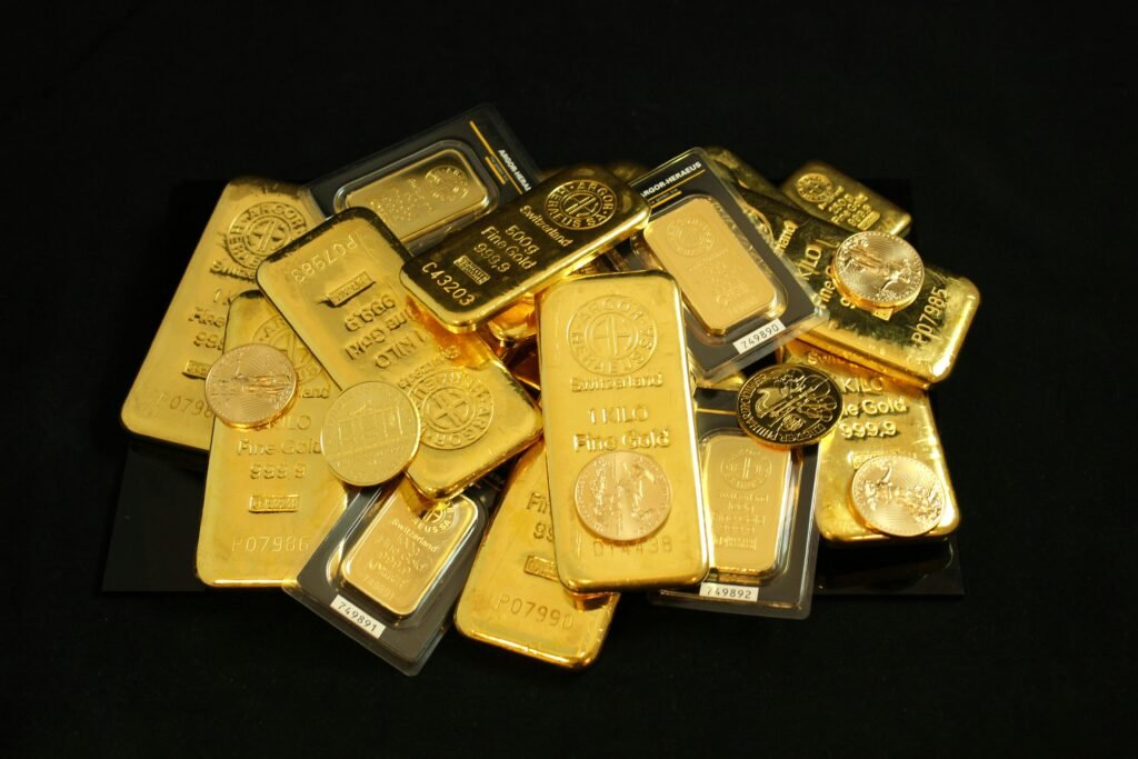 pexels-photo-8442332-8442332 A collection of gold bars and coins symbolizing wealth and investment.